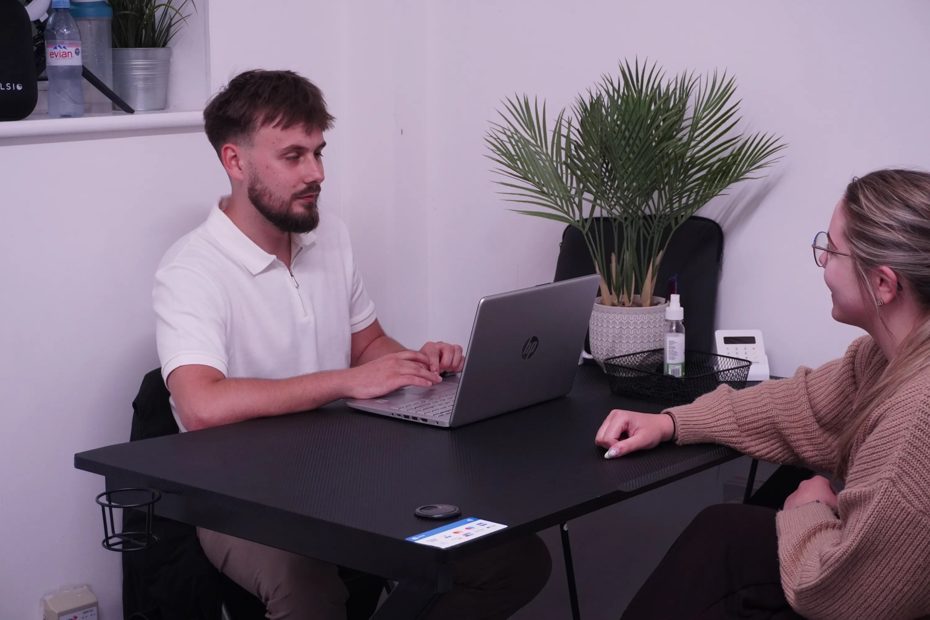 Daniel Marzec consulting with a client about sports massage therapy in Swansea