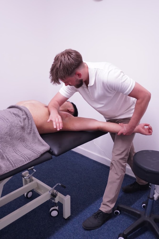 Upper back sports massage during Hyrox race week preparation at Muscle Relief Therapy Swansea